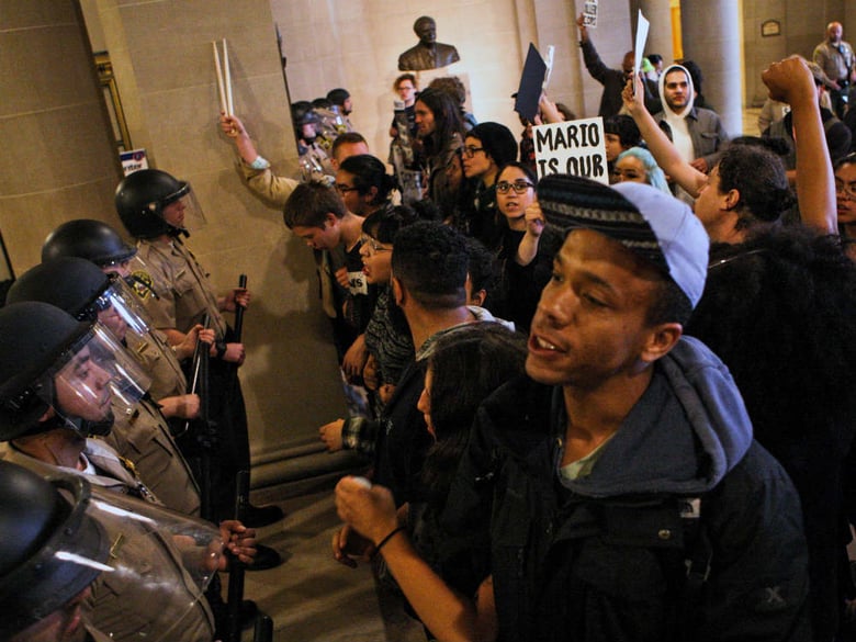 Protesters face off with San Francisco deputy sheriffs on Friday, May 6, 2016 during a protest against SFPD and in support of the Frisco 5 hunger strikers in San Francisco. 